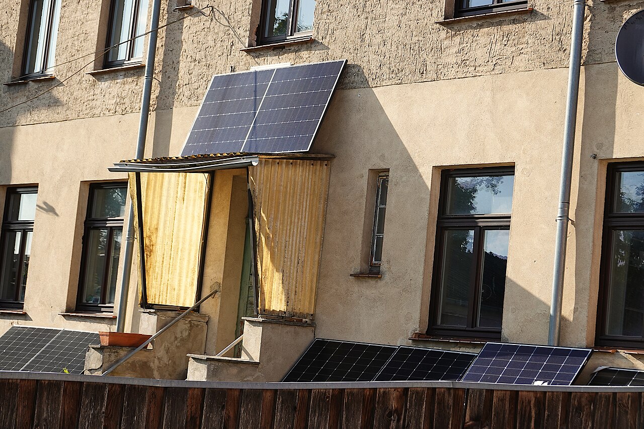 Small solar panels mounted around balconies in Wesenberg, Germany